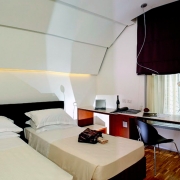 double hotel room with black curtain