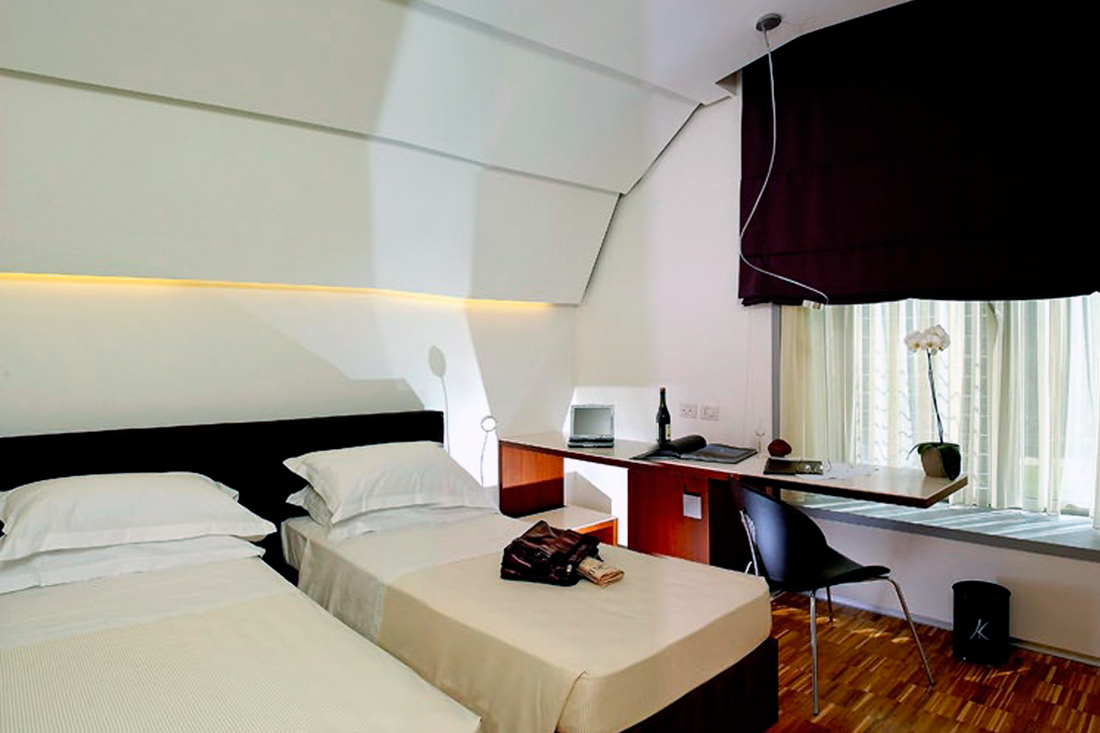 double hotel room with black curtain