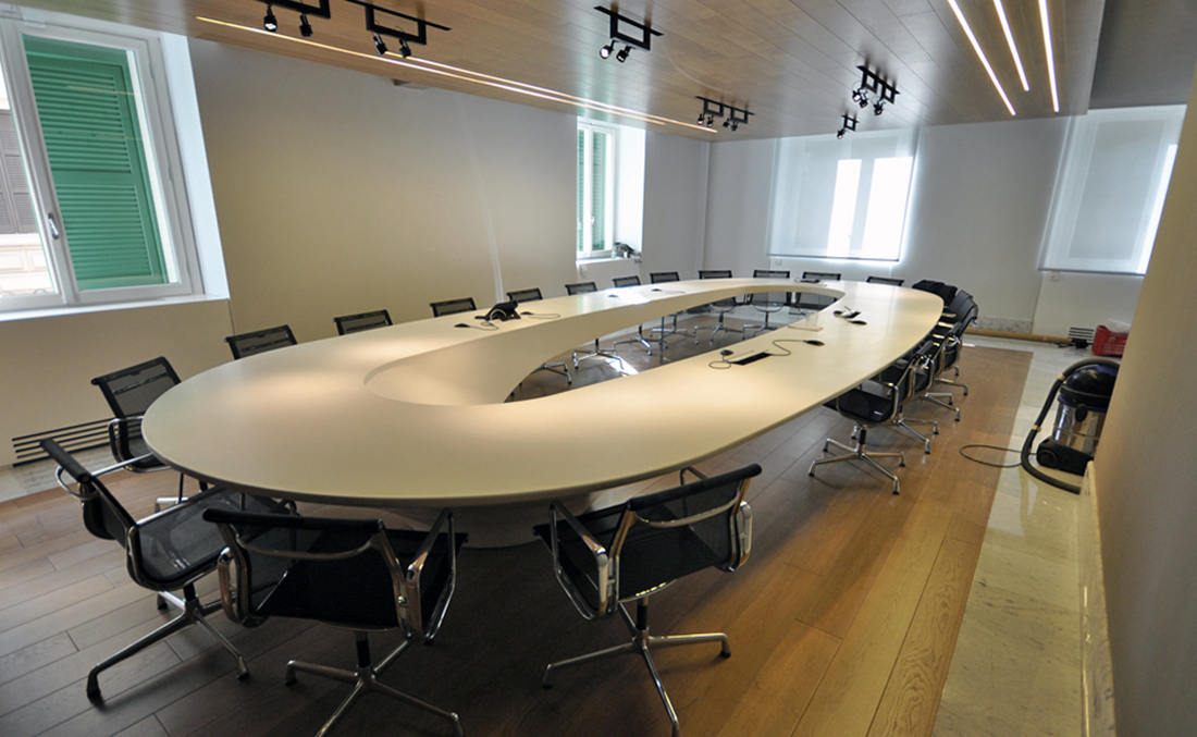 white round meeting table in solid surface
