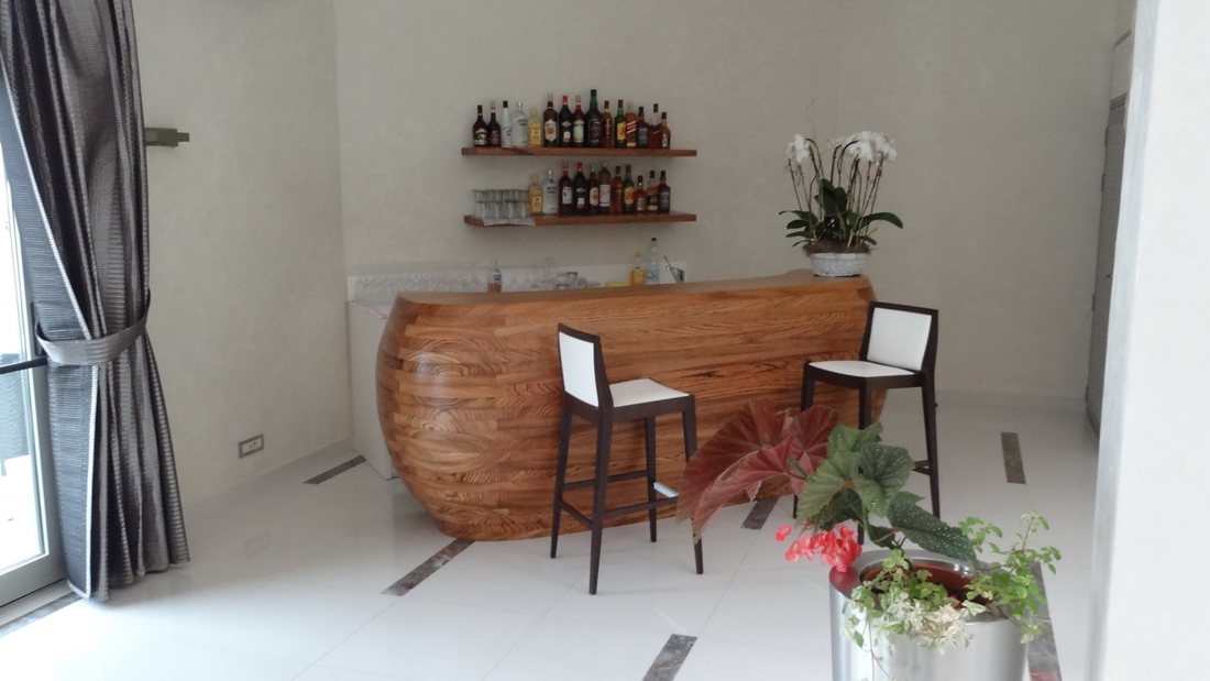 bar corner with double-curving wooden counter