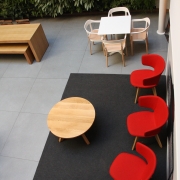 red armchairs and wooden tables