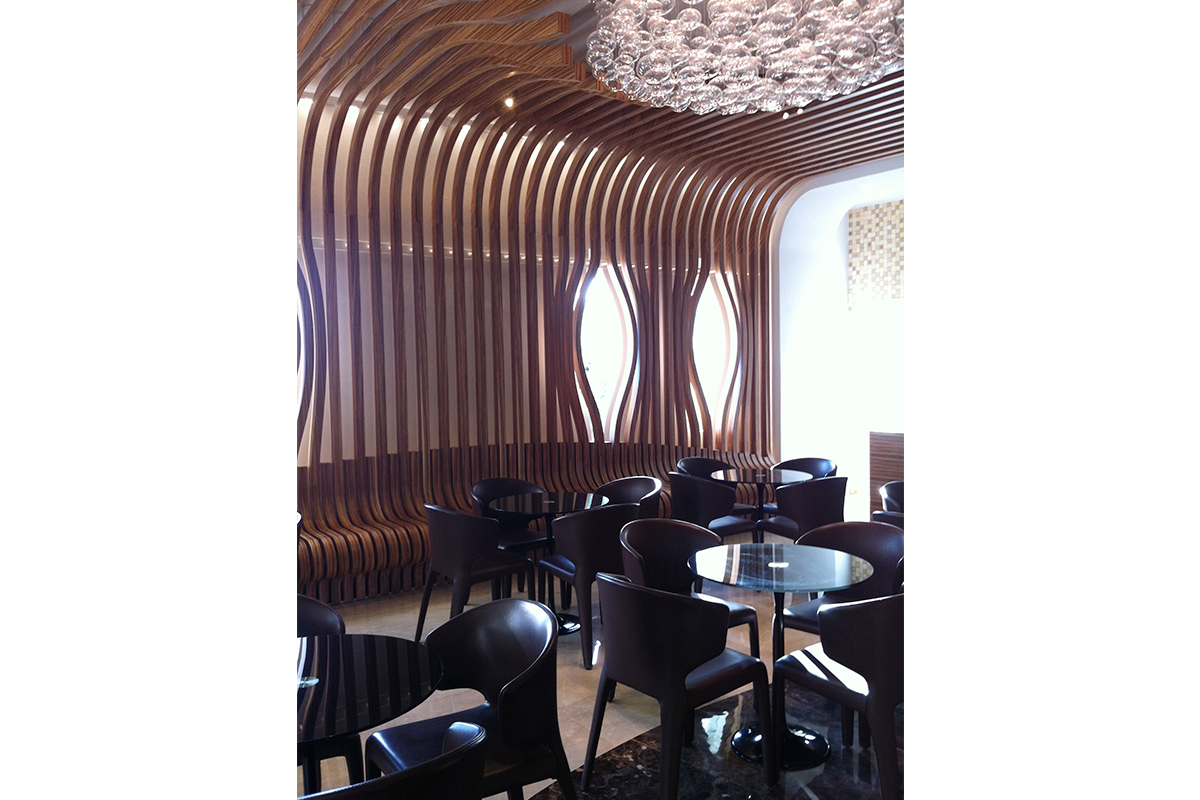 black bar tables and wooden curving cladding