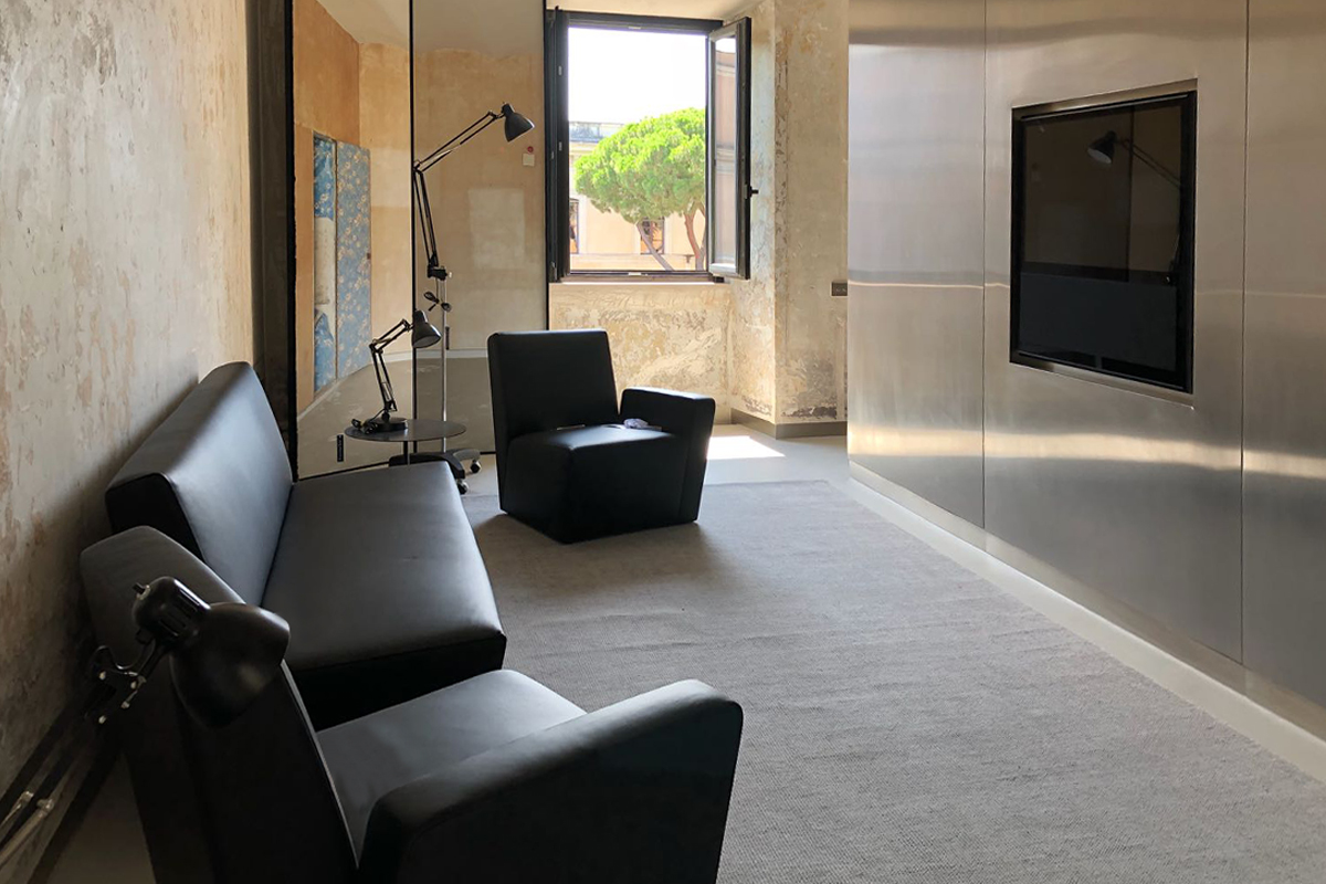 Palazzo Rhinoceros apartment with bespoke stainless steel cabinets and armchairs by Jean Nouvel Design