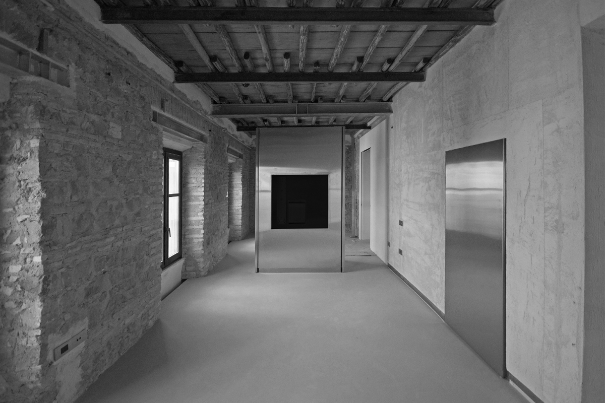 stainless steel TV unit installation Palazzo Rhinoceros Devoto Design