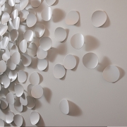 white metal disks on the wall