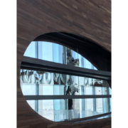 Detail of the double-curved American walnut walls of the Vertigo restaurant inside the Banyan Tree Doha hotel