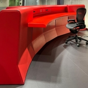 curving red desk, chair