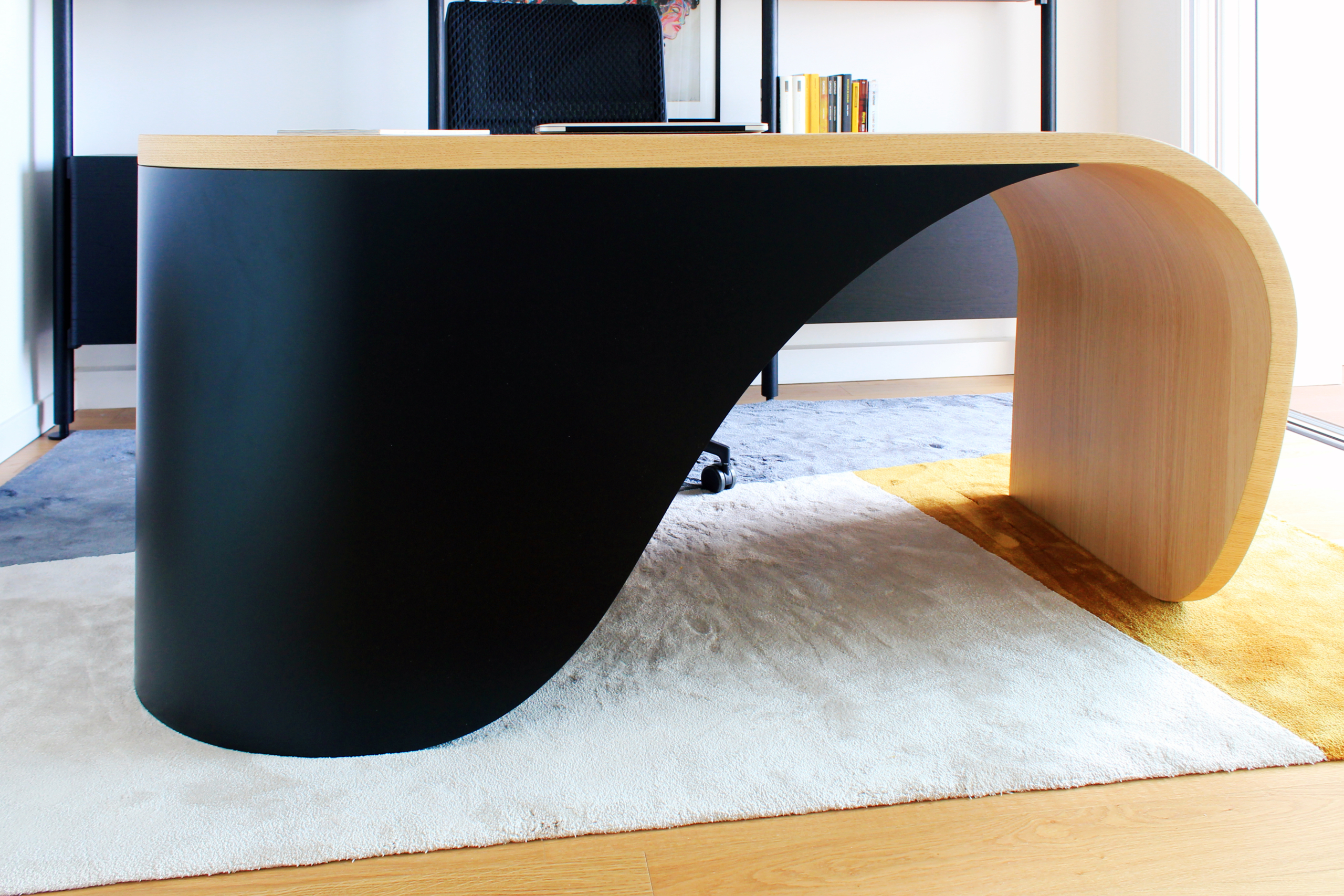 double-curving wooden desk