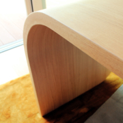 curving wooden desk leg