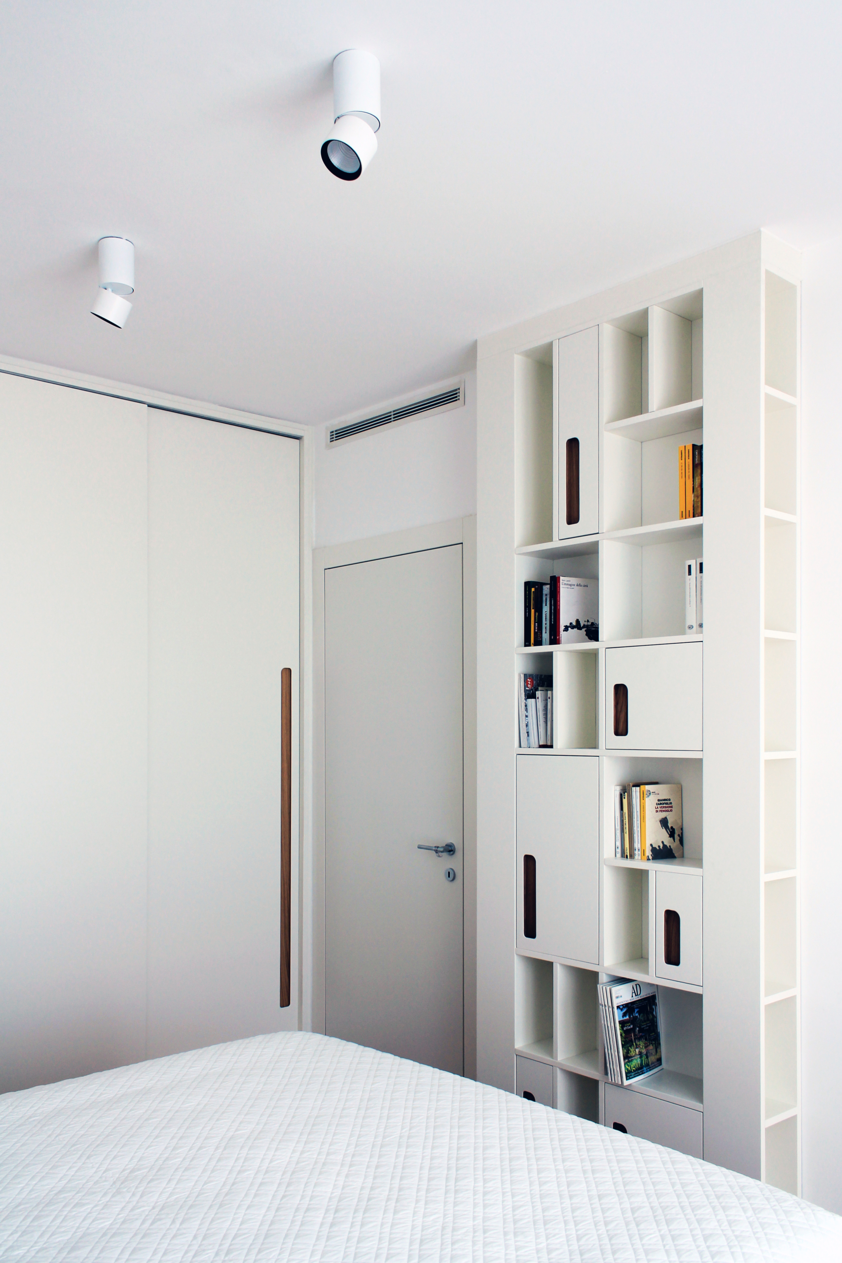 white floor-to-ceiling bookcase